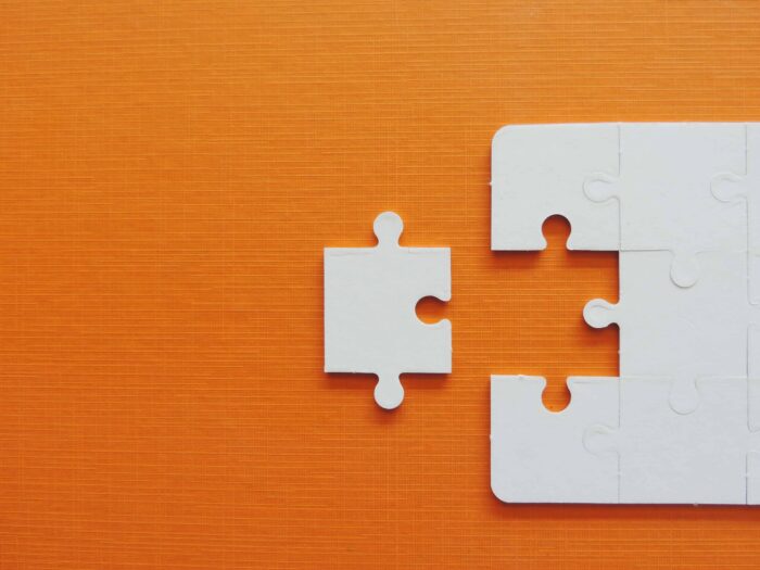 Partnership law image of puzzle piece fitting in